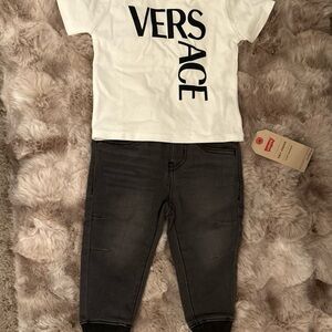 Versace shirt and Levi’s pants